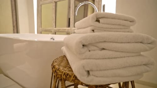 Modern Bathtub with Stacked White Towels