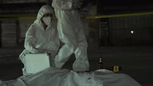 Forensic Experts Examining Corpse at Crime Scene