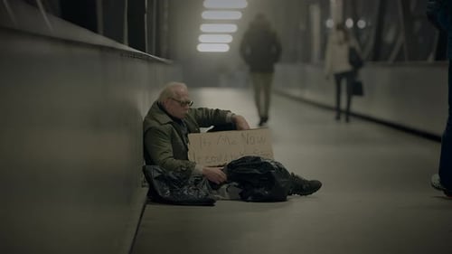 Elderly Homeless Man Suffering From Poverty Looking for Help at Train Station