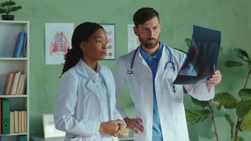 Professional Team of Multiethnic Doctors Cooperating in Medic Healthcare Clinic Male and Female