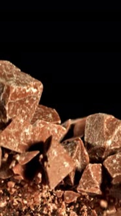 Super Slow Motion Pieces of Dark Milk Chocolate Filmed on a Highspeed Camera at 1000 Fps