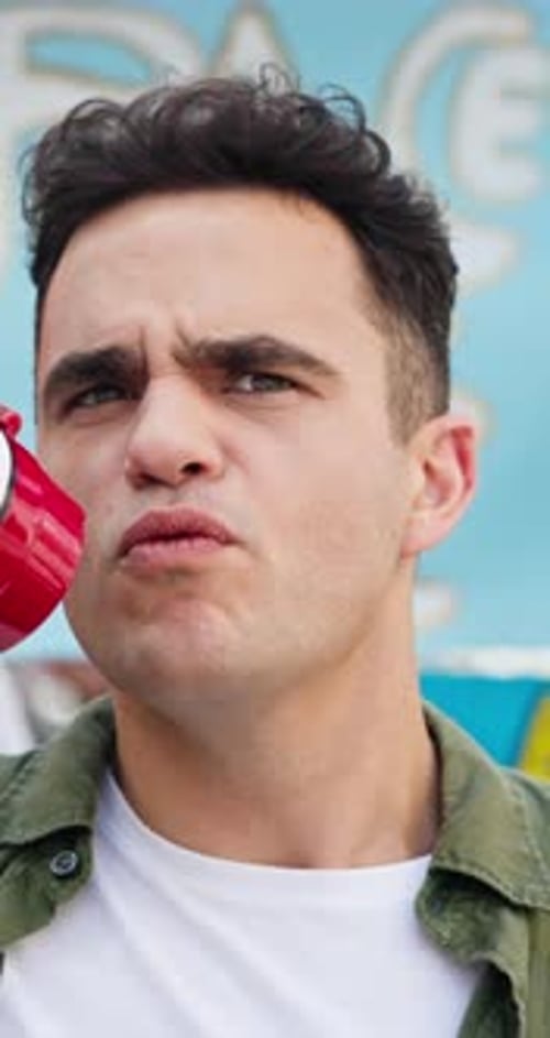 Man Yelling into Red Megaphone Up Close