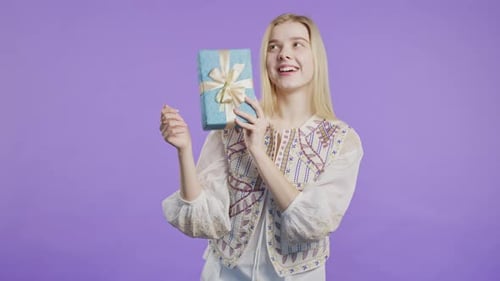 Happy Woman Holding Birthday Present Box