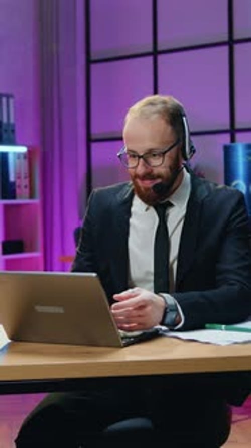 Goodlooking Modern Surprised Contented 30Aged Bearded Office Manager in Business Suit and Wireless