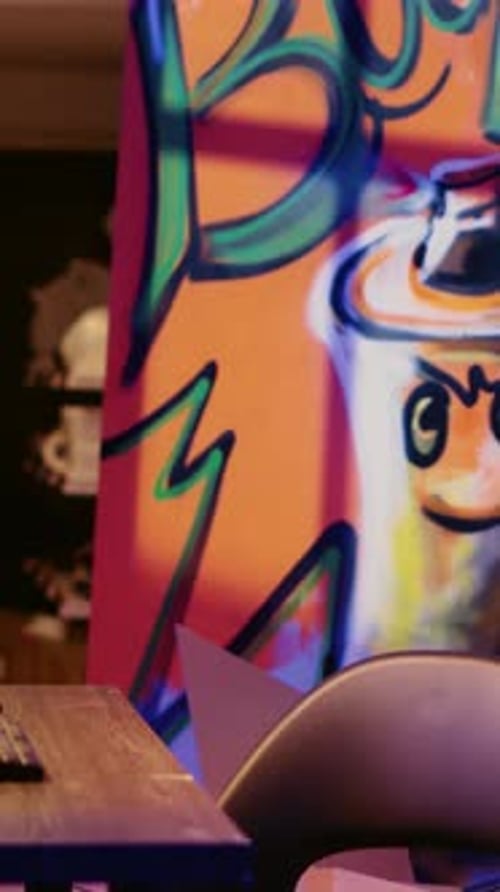 Computer Screens Displaying Code in Dimly Lit Room