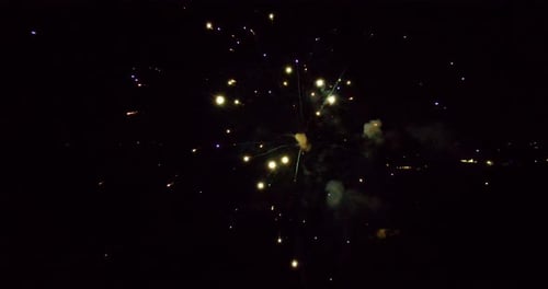Aerial footage of green fireworks.