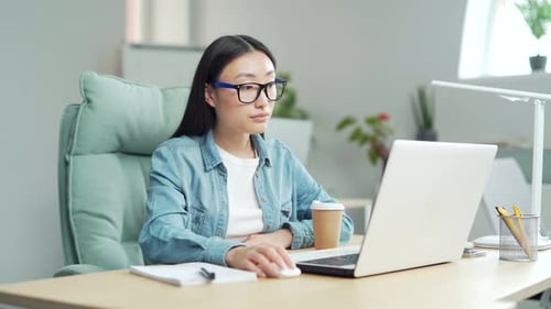 Woman Working from Home on Computer
