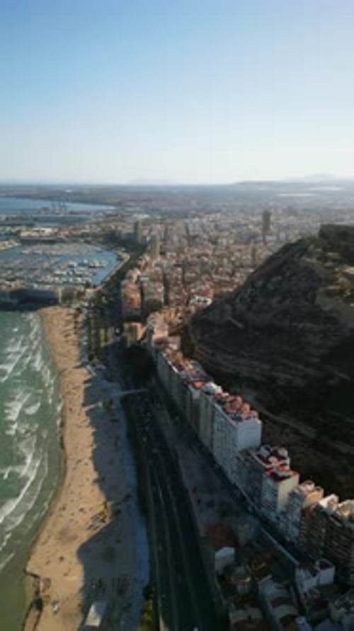 Aerial drone view of the Santa Barbara Castle on the coast of Alicante, Spain with the city and the