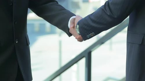 Business Handshake in Urban Office Setting