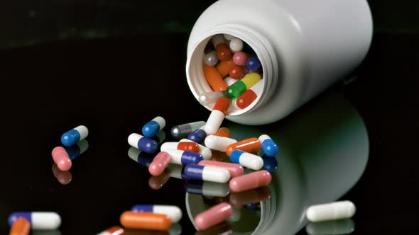Pill bottle falls over and slips pills in slow motion., Medical Stock ...