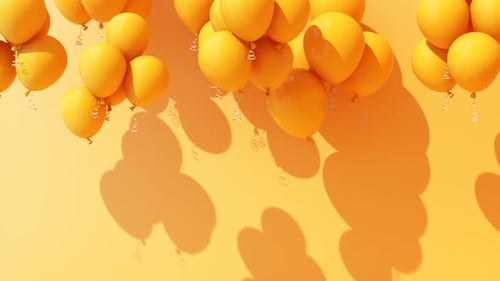 Ballons jaune vif sur fond orange