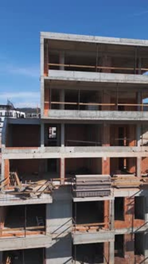 Construction Site of a Highrise Building at Sunny Day The Structure's Concrete Framework Cranes and