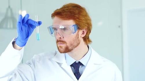 Scientist Holding a Test Tube in a Lab