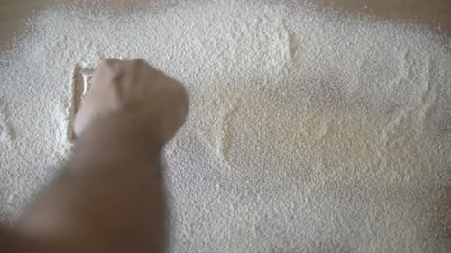 Hand Writing "Flour" in White Baking Ingredient