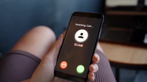 Scam Alert on Mobile Phone Screen