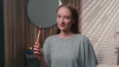 Caucasian Smiling Toothy Girl Woman Happy Female Lady in Home Bathroom Holding Toothbrush Clinic