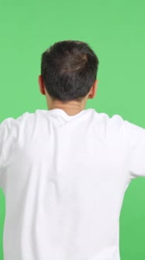Rear View of a Man Waving a Greek Pennant