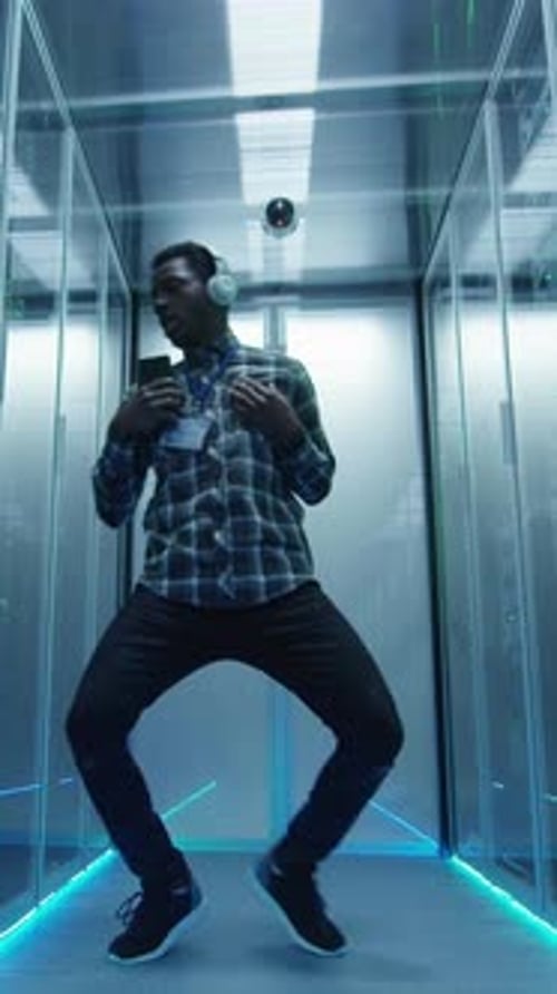 Young Adult Dancing in Futuristic Data Center