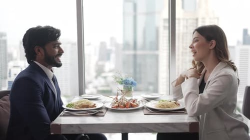 Couple have a meal at high floor tower.