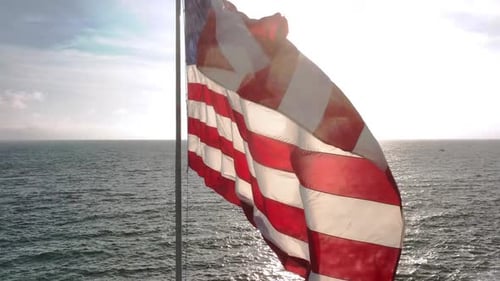 American Flag in Coastal Wind US Flag Over Open Water Flag Rippling in Ocean Air American Flag Above