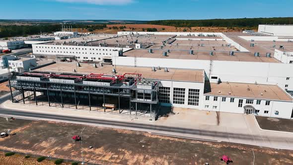 View on the facade of the large modern factory. Exterior of the ...