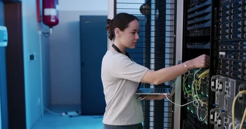 Young Adult Working in Server Room