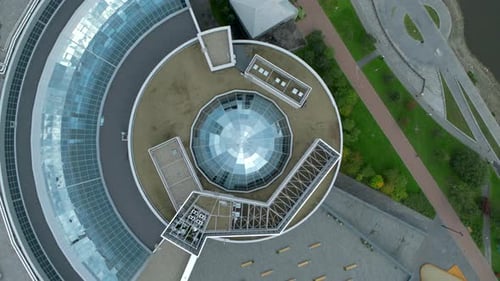 Top view of modern round building with dome. Stock footage.