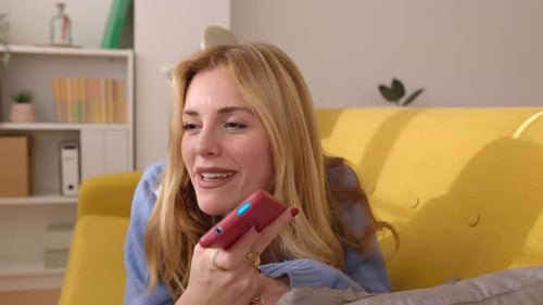 Woman Relaxing on Couch Chatting on Phone