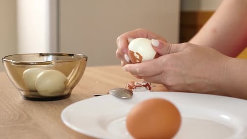 06Peeling a boiled egg. Preparing dishes with eggs.