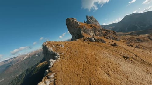 Smooth Flight Along the Mountain Range Filmed By FPV Drone Seceda Italy