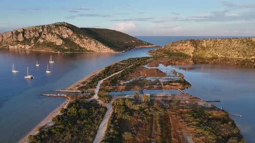 Aerial view circular pan left from Gialova Lagoon to the Beach.A little channel in between.