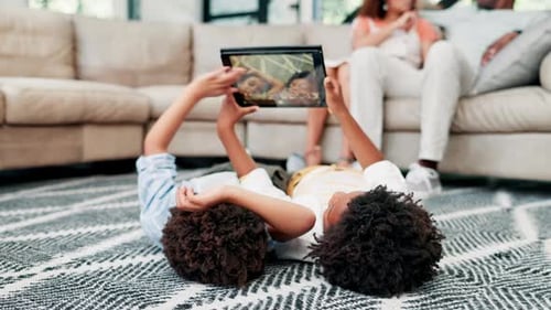 Kids, carpet and tablet with fun, relax and happiness with weekend break and peaceful in a lounge