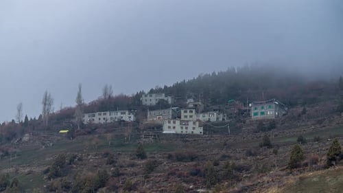 Time-lapse of fog around a village nestled in Lahaul Valley's mountains.