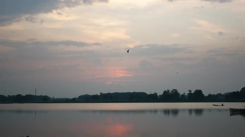 Golden Sunset Reflected on Calm Lake Water