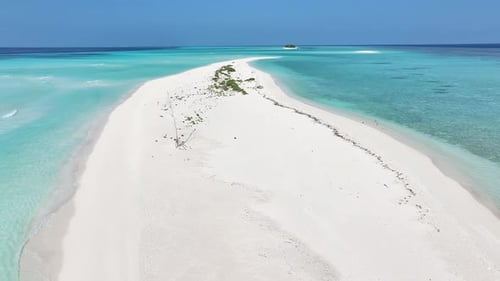Aerial view of island with turquoise sea, Maldives.