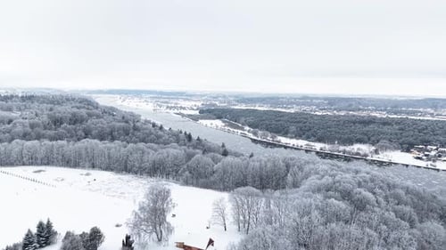 Aerial View of Snowy Winter Landscape and River