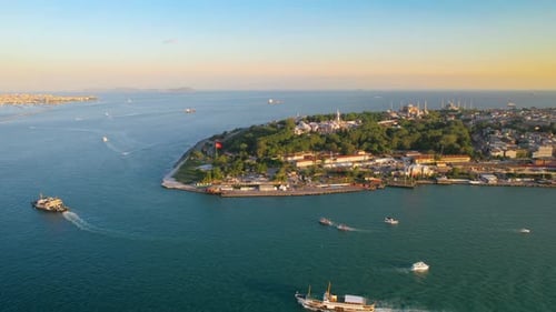 Aerial drone view of Istanbul at sunset, Turkey. Bosporus strait with floating ships, Sultanahmet di