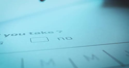 Question on test sheet of paper is answered by crossing NO, close-up