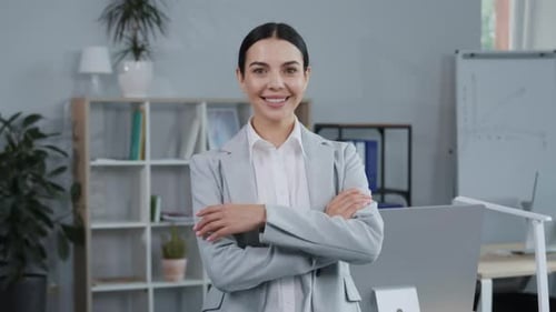 Portrait of Cheerful Elegant Beautiful Caucasian Secretary Looking Straight to Camera in Office
