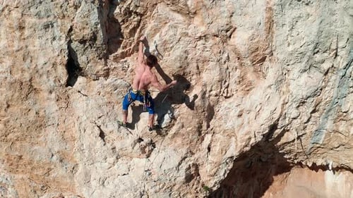 Rock climber climbing the rock 4
