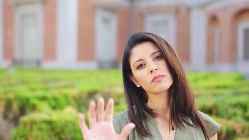 Woman Gesturing Stop with the Hand with Serious Expression