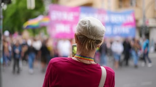 Crowd at Pride Parade With Colorful Banners