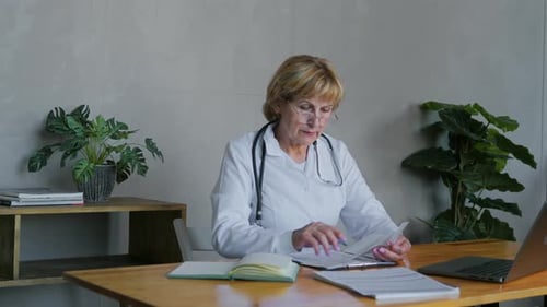 An Adult Experienced and Professional Doctor Works in an Office