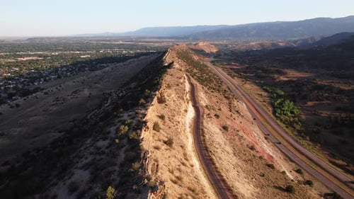 A mountain range in the middle of the steppes, with a motor road