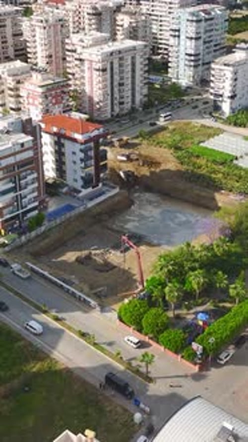 Vertical Video Heavy Machinery and Builders Collaborate Seamlessly to Begin Work on a New