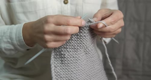 Woman's Hands Knitting Gray Wool Material