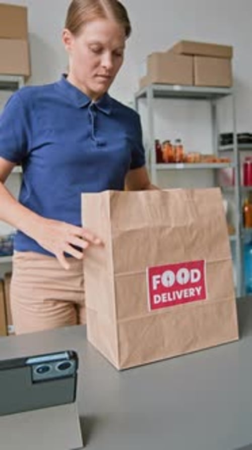 Female Worker Collecting Fresh Produce for Customer Order in Dark Store