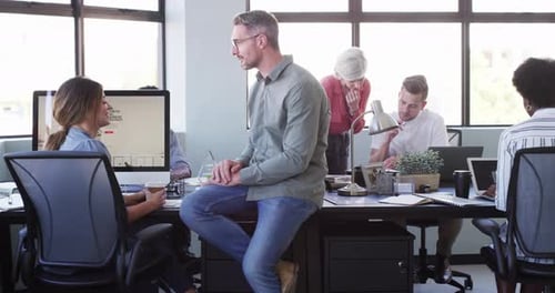 Colleagues, manager and office with computers, conversation and pointing at pc screen