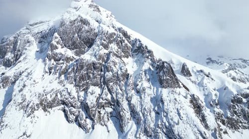 Orbit Shot Of High-rise Fronalpstock Glarus Snowy Mountains, Switzerland