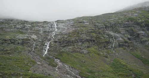Waterfalls Cascading Down a Rocky Mountain in Norway